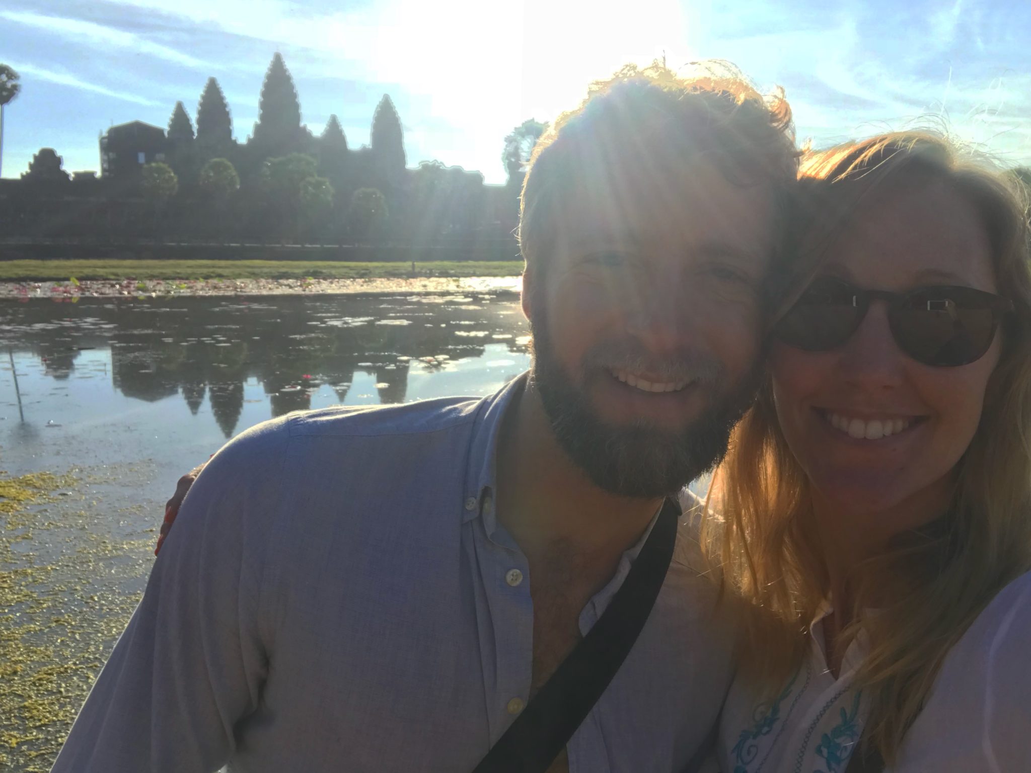 Hayley and Enrico standing in front of Angkor Wat at sunrise 