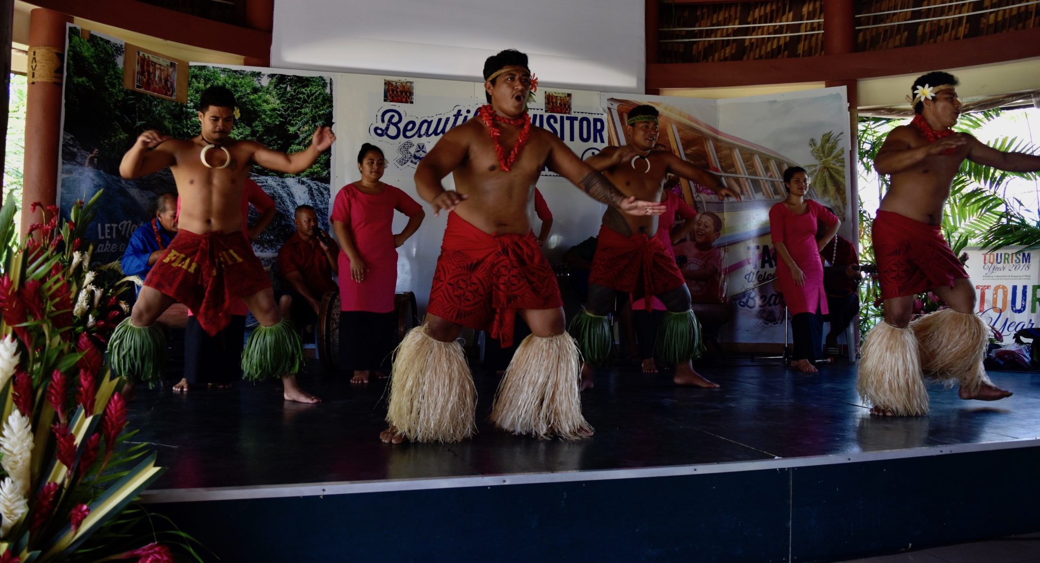 Locals demonstrating traditional Samoan dance on stage at the Samoan Cultural Village in Upolu. 