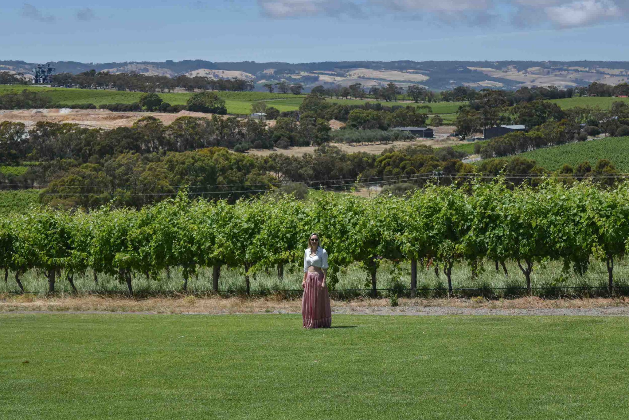 Hayley walking along the vines at Mollydooker winery in McLaren Vale 
